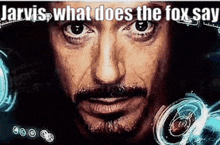 a close up of a man 's face with the words `` jarvis , what does the fox say '' .