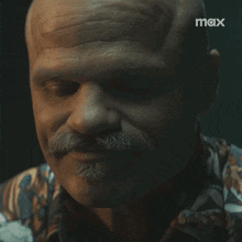 a close up of a man 's face with the word max on the bottom right