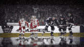 a hockey game is being played in front of a toronto maple sign