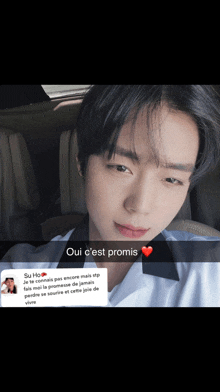 a picture of a young man with a heart and the words oui c'est promis on the bottom