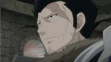 a man with a beard and earrings on his ears