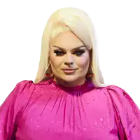 a woman with blonde hair wearing a pink top with stars on it