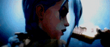 a close up of a person 's face with blue hair holding something in their hand .
