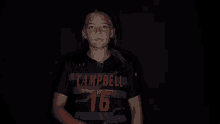 a girl wearing a shirt that says mpb 16