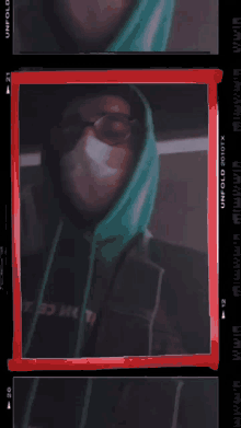 a man wearing a mask is behind a red frame that says unfold