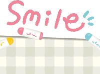 the word smile is written on a piece of paper with crayons