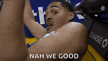 a basketball player says nah we good in front of a chase bank logo