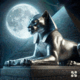 a statue of a cat in front of a pyramid