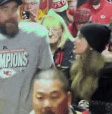 a man wearing a shirt that says champions on it