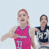a woman wearing a pink washington jersey number 23