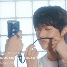 a person is singing into a microphone with the words i 'm your type say you say you say on the bottom