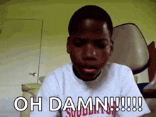 a young boy in a white shirt says " oh damn "