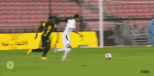 a soccer game is being played on a field with a clock that says 0:02