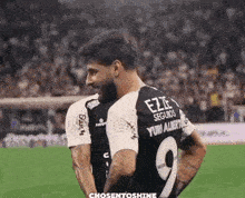 a soccer player wearing a jersey with the number 9 on it