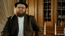 a man with a beard wearing a top hat and a suit