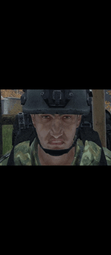 a close up of a man wearing a helmet and a backpack