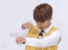 a person wearing a yellow vest that says jimin on the front