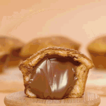 a close up of a cupcake with chocolate icing on it