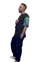 a man with a tattoo on his arm is singing into a microphone while wearing a black shirt