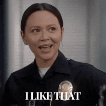a woman in a police uniform has the words i like that above her
