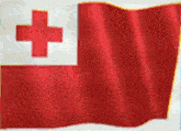 a red curtain is waving in the wind and has a cross in the background