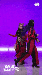 a group of women are dancing in front of a purple background that says relay dance on it