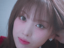 a close up of a woman 's face with a pink lip