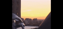 a blurry picture of a city at sunset