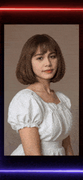 a woman in a white dress with puffed sleeves stands in front of a red and blue light
