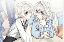 a boy and a girl are sitting next to each other and looking at each other