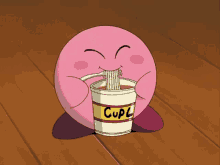 kirby is eating noodles from a cup that says cupl on it