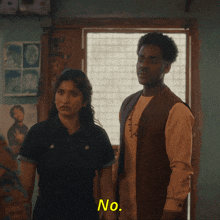 a man and a woman are standing next to each other with i told him to go written in yellow