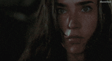 a blurry picture of a woman 's face with illusive soul written on the bottom left