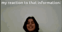 a woman is wearing headphones and says my reaction to that information .