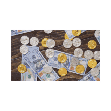 a pile of 100 dollar bills and coins on a wood table
