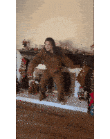 a woman is dancing in front of a fireplace with stockings on it