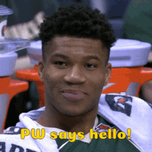 a young man with a towel around his neck says " pw says hello "