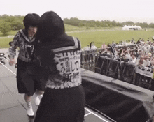 a girl wearing a shirt that says ' samurai ' on the back