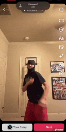 a man wearing a balaclava is dancing on a tiktok app