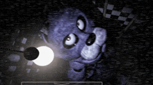bonnie from five nights at freddy 's is looking up at a light in a dark room .