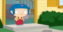 a cartoon boy wearing a blue helmet is standing on a porch .