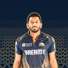 a man is wearing a shirt that says dream11