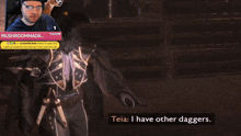 a man playing a video game with a bird on his head and the words " teia i have other daggers "