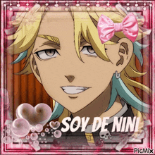 a picture of a boy with a pink bow on his head and the words soy de nini