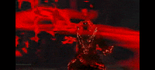 a person is standing in the middle of a red liquid .