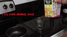 a box of minute maid orange juice sits on a stove top