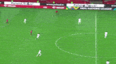 a soccer game is being played in a stadium with an orlen banner