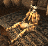 a statue of a man sitting on a rug playing a drum