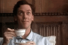 Spill The Tea Hugh Laurie GIF - Spill The Tea Hugh Laurie Giggle GIFs