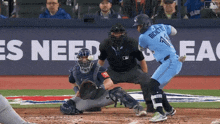 a baseball player named bichette is swinging at a pitch